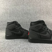 Rear-side view of the pair showing the black collars, tonal branding, and heel embroidery.