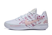 Side profile of a white basketball shoe with pink floral graphics and a pale pink Swoosh.