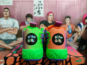 Rear view of the sneakers showing contrasting green and orange heel panels, black circular graphics, and purple outsole accents.