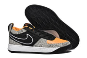 Side and outsole view showing the Nike Swoosh, spotted overlays, white midsole, and patterned black outsole.