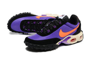 Angled view of purple, orange, and black Nike Air Max Plus Utility sneakers.