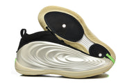 Side profile and outsole view showing sculpted panels and circular traction zones