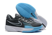Nike basketball shoes displayed with one shoe showing the textured light blue and white outsole.