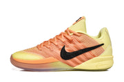Side profile of a yellow and orange Nike Kobe basketball shoe with a black Swoosh.