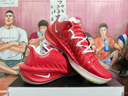 Angled view of red Nike GT basketball shoes with white laces and Swoosh branding.
