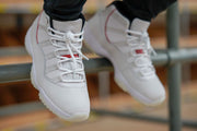 Close worn view of both sneakers showing the laces, tongues, and toe areas.