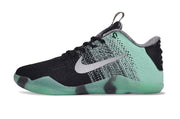 Mint green and black low-cut basketball shoe, side view