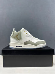 Side profile showing the off-white and tan mid-top sneaker, perforated panels and visible cushioning window.
