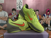 Three-quarter view of the lime green Nike sneakers showing the side branding, layered upper, and dark outsole accents.