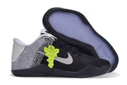 Black and white shoe with outsole visible beside a matching shoe