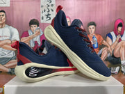 Angled view of the pair highlighting the padded collars, red accents, and cream-colored soles.