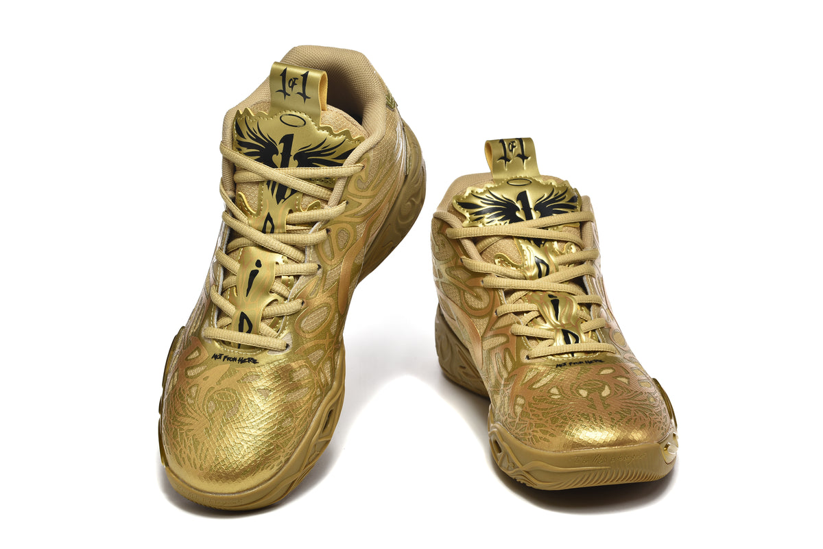 Pair of gold high-top Puma sneakers shown from the front with black and gold tongue graphics.