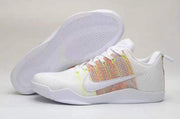 White low-top sneaker shown beside its textured outsole.