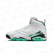 Side profile of a white and mint green Jordan high-top sneaker with black detailing, patterned heel accents, and a visible Air unit.