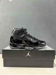 Side profile of a black high-top sneaker displayed on a Jordan shoebox.