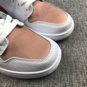 Close-up of the rose-gold toe panels and white textured overlays.