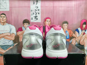 Rear view of the sneakers showing the translucent heel sections, white heel panels, and pink outsole accents.