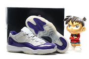 Side view of a purple and white sneaker beside another shoe with its translucent outsole facing the camera.