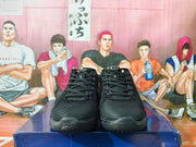 Front view of a pair of black Nike basketball sneakers.