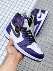 Close-up of the sneaker with its gold hangtag and a second shoe in the background.