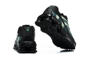 Rear and outsole views of black Nike Shox Ride 2 sneakers.