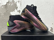 Two high-top shoes displayed together, showing textured dark red side panels, black uppers, and lime-green heel accents.