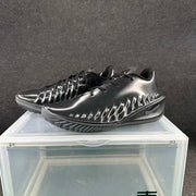 Pair of black Nike GT basketball shoes displayed from an angled side view.