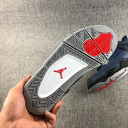 Close view of the patterned grey outsole with red traction sections and a red Jordan emblem.