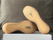 Underside view of the sneakers showing translucent amber-colored outsoles.