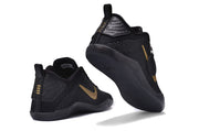 Black and gold basketball sneakers shown from the rear and outsole.
