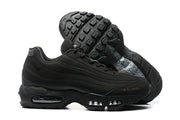 Side and outsole views of black Nike Air Max 95 sneakers showing visible air units and patterned outsole detail.