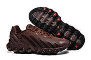 Brown Nike Air Max DN8 sneakers shown from the side and outsole, with black tread and red accents.