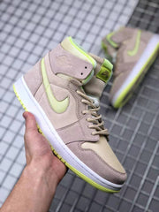 Front three-quarter view showing the beige upper, neon yellow-green collar accents, tonal laces, and side Swoosh.