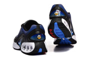Rear and outsole views of black and blue Nike sneakers