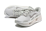 Pair of light grey Nike sneakers shown from above at an angle.