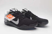 Pair of black and grey Nike Kobe 11 shoes viewed from the front