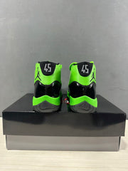Rear view of the pair showing green heel panels, black accents, and a visible 45 marking.