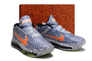 Blue-patterned Nike GT Hustle 3 pair shown in front of an orange patterned shoe box.