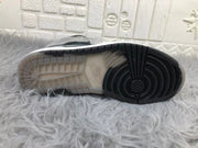 Close-up of the sneaker outsole showing black circular traction at the forefoot and a translucent section beneath the midfoot.