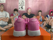Rear view of pink Nike basketball sneakers showing perforated heel panels, heel branding, and white midsoles.