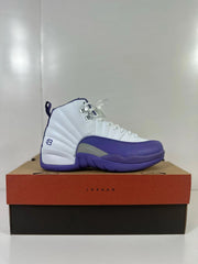 Side view of a white and purple Air Jordan 12 Retro