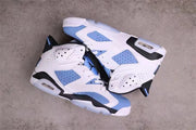 Jordan 6 sneakers arranged to show the outer side panels, heel structures, and translucent outsole sections.