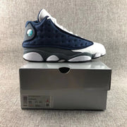 Air Jordan 13 Flint side profile displayed on a shoebox; the box label shows sample size 11.