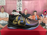 Side view of a Nike basketball sneaker showing purple and black panels, gold Swoosh detailing, and a translucent outsole.