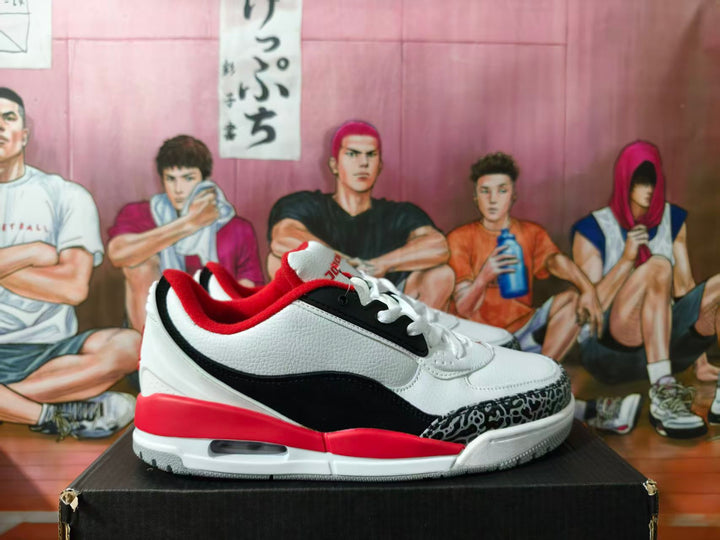 Side view of a white, black, and red low-top Jordan sneaker with a patterned toe overlay.