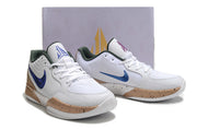 White and tan Nike Ja 2 shoes displayed in front of a branded shoe box