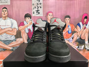 Front view of black high-top sneakers showing black laces, light tongues, and red Jumpman branding.