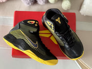 Top view showing the toe boxes, black laces, patterned side panels, and Kobe logo detail on the tongue.