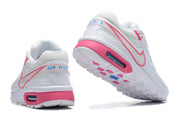 Rear and outsole views showing the pink heel accents and blue Air Max branding.