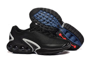 Black Nike sneakers shown from the side and with the outsole visible